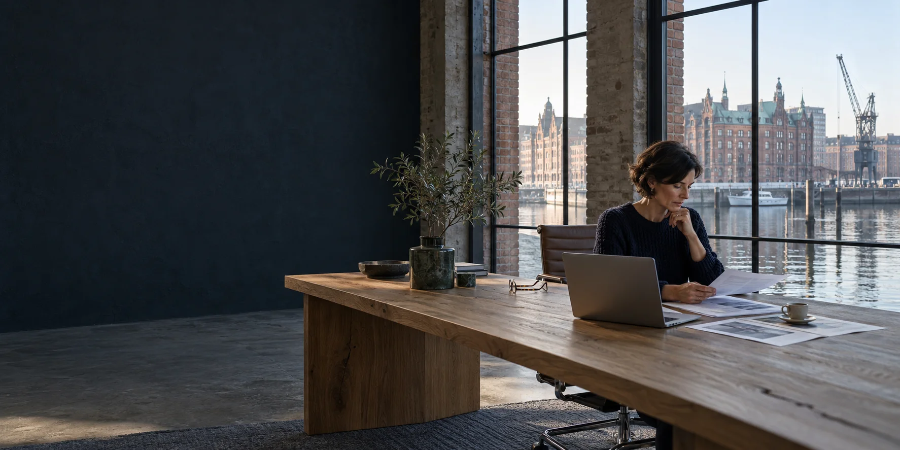 AI-generated scene of an entrepreneur reviewing investment documents overlooking Hamburg harbour.